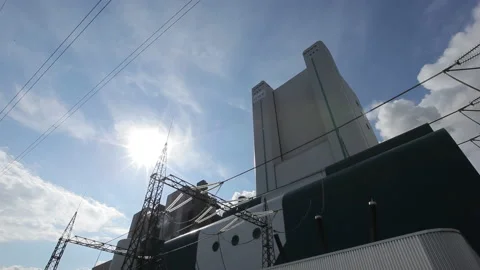 Timelapse of Power Plant with Moving Clouds and Dynamic Sky in Industrial Scene Stock Footage 220596963