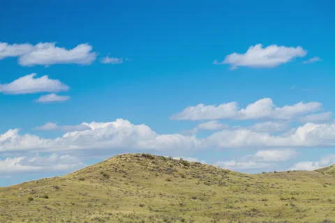 Timelapse prairie hill side with blue sky and clouds Stock Footage 62184379