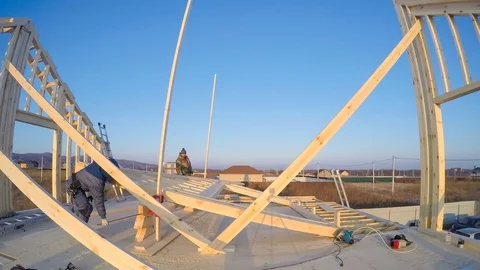 Timelapse: process of lifting attic frame on its place. Frame house building Stock Footage 123094884