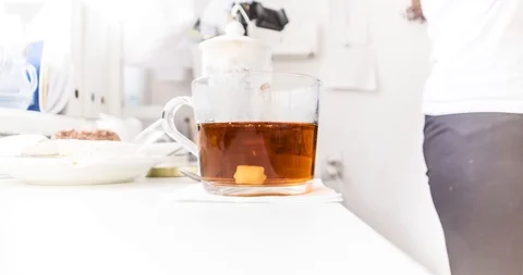 Timelapse of the process of pouring boiling water and preparing delicious tea Stock-Footage 129595177