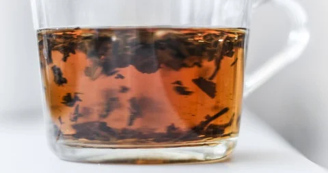 Timelapse of the process of pouring boiling water and preparing delicious tea Stock-Footage 129595373