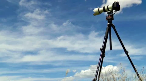 Timelapse of the professional camera on a tripod shooting cloudscape Stock Footage 46866317