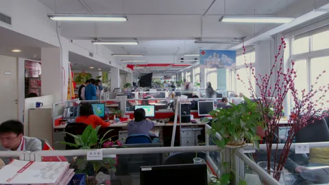 Timelapse Of Professionals Working At Desks In An Office, Beijing China Stock Footage 140485144