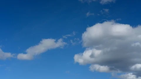 Timelapse of puffy clouds over a blue sky 2 Video stock 95661609