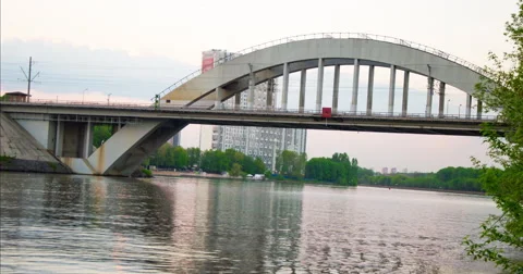 Timelapse Railway Bridge Across the River - Drive Trains and Ships Float Stock Footage 63023632