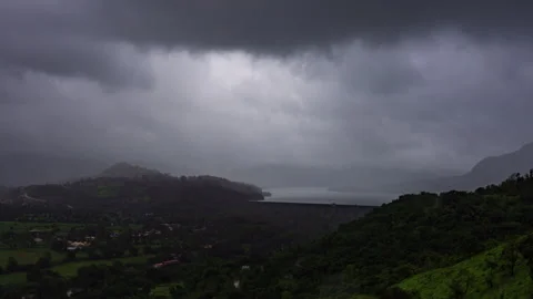 Timelapse - Rain and dark clouds over a dam 4K60 Stock Footage 271237178