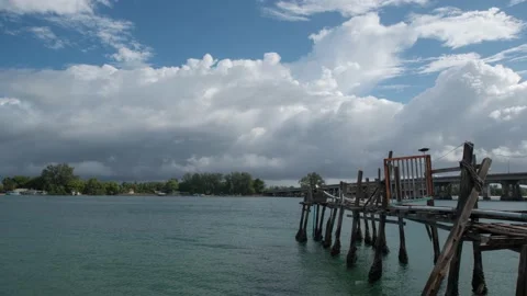 Timelapse Rain clouds are passing over a fisherman's fishing port. Video stock 205394268