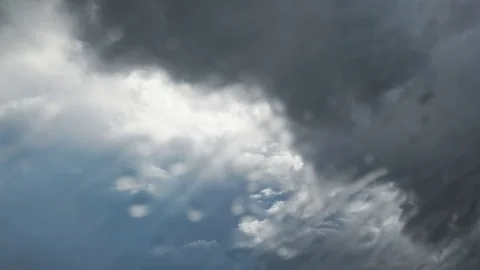 Timelapse of rain clouds behind a window change to bright blue sky Stock Footage 80096468