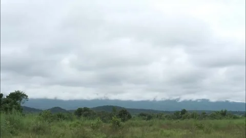 Timelapse of rain clouds billowing over beautiful mountain landscape Video stock 145540152