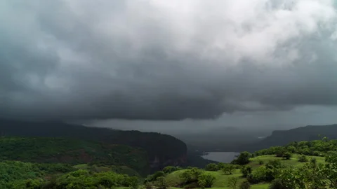 Timelapse - Rain clouds moving over a valley 4K60 Stock Footage 269123464