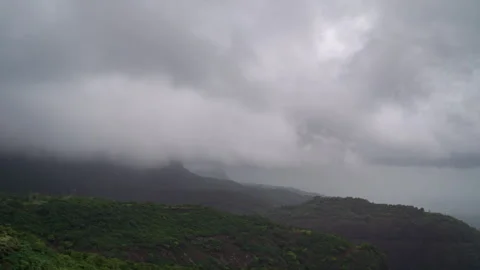 Timelapse - Rain clouds moving over a valley 4K60 Stock Footage 269123993