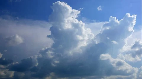 Timelapse - Rain clouds rising high into the sky Stock Footage 134168158