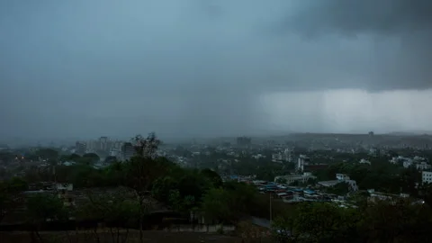 Timelapse - Rain coming in and falling over a city 4K30 Stock Footage 271198832