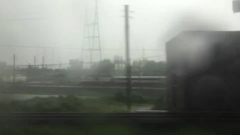 TIMELAPSE | Rain falling on train window passing through New York City Stock Footage 317288141