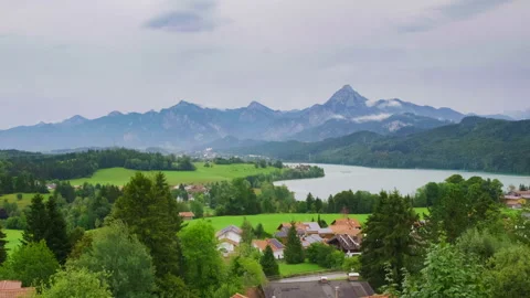 Timelapse of a Rain Shower Clearing to Sunshine over Lake Weißensee, Säuling Stock Footage 344326397