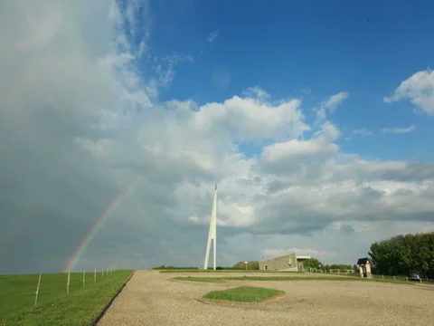 Timelapse of rainbow in cloudy sky over monument Etretat, France Stock Footage 46179918