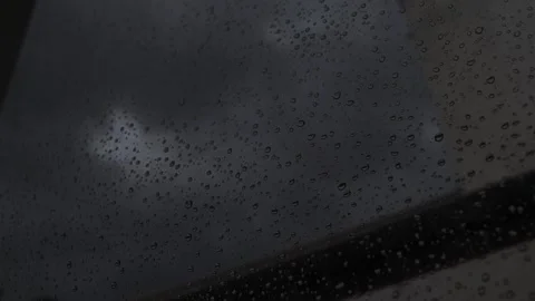 Timelapse of Raindrops on the Window, Day to Night Transition Stock Footage 321901628