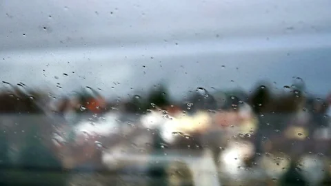Timelapse of rainstorm hitting window with slight flex of the window Stock Footage 104130225