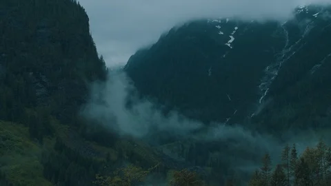 Timelapse Of Rainy Clouds Forming In Mountain Valley 스톡 동영상 111986197