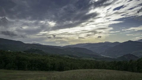 Timelapse of rainy clouds over wild mountains Stock Footage 117715825