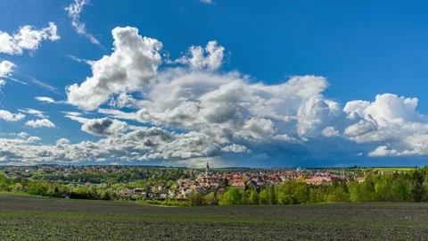 Timelapse of rainy clouds passing over Czech town Stribro Stock Footage 154504870