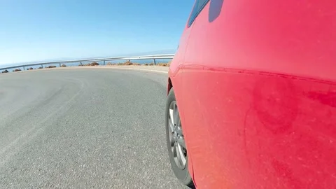Timelapse of a Red car speeds down scenic switchback road running through the id Video stock 169928249