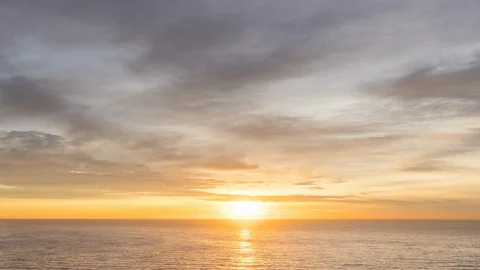 Timelapse of a Red Fire Sky Sunrise over the Ocean Stock-Footage 129667951