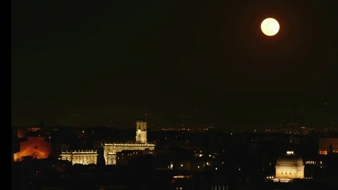 Timelapse red moon rises above the roofs of Rome Stock Footage 104987057