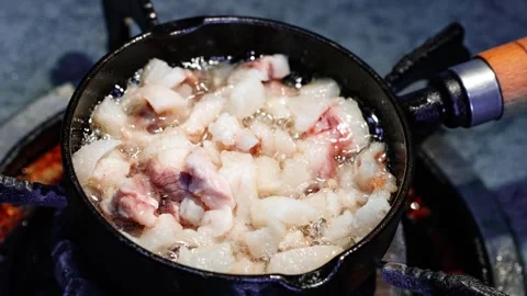 Time‑lapse of rendering pork fat in cooking pan Stock Footage 344773700