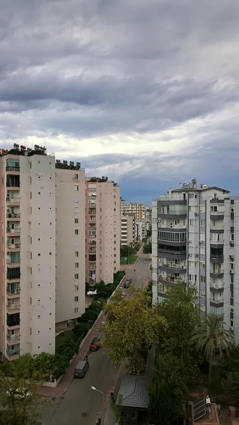Timelapse of residential cityscape under fast moving dramatic storm clouds Stock Footage 345818385
