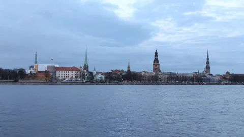 Timelapse of Riga old city, cloudy evening turns in to illuminated night Stock Footage 247901888