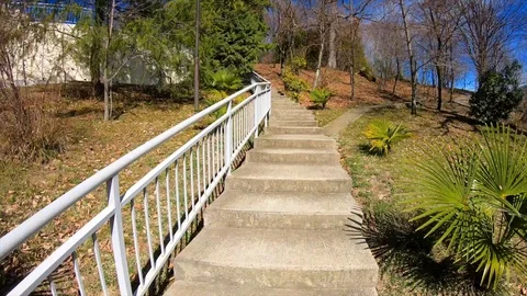 Timelapse rises down a pedestrian staircase to a slide Stock Footage 129667729