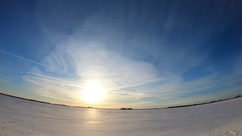 Timelapse.The river is covered with ice. Bright and colorful sunset.Evening. Stock Footage 87670933