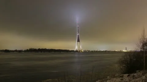 Timelapse river with lighted high tower 4k Stock Footage 10768798