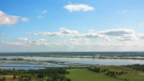 Timelapse. River in mountain valley. Movement of clouds across the sky. Stock Footage 122256419