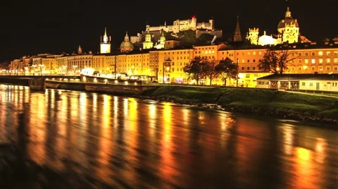Timelapse of River Salzach flowing through Salzburg at night Stock Footage 46876429