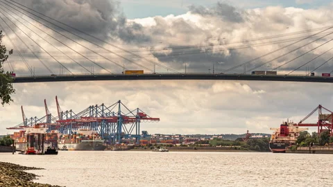 Timelapse of river traffic. A container ship sets sail for the port of Hamburg Stock Footage 166317380