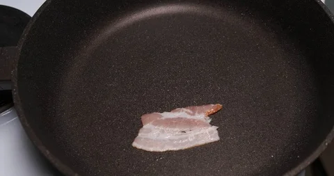 Timelapse of roasting meat in pan, bacon dries, loses moisture, heat treatment Stock Footage 120895641