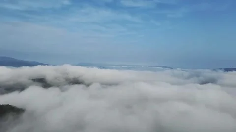 Timelapse of a Rolling Cloud Sea Over Majestic Mountains in China Stock Footage 337859336