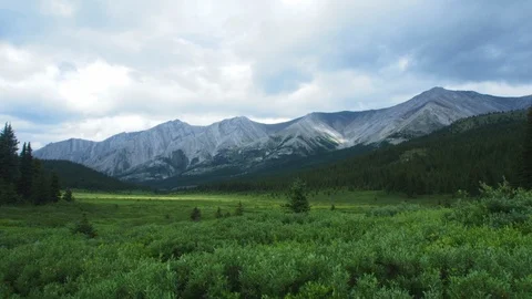 Timelapse of rolling clouds and rain in the wilderness of Banff National Park	 Stock Footage 99270390