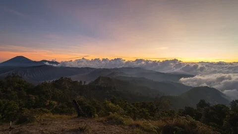 Timelapse of rolling clouds during sunset overlooking Mount Semeru near Bromo Stock Footage 96341087