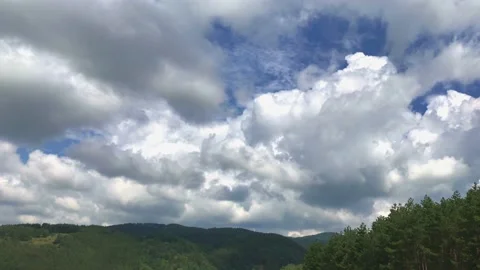 Timelapse Of Rolling Clouds going across a blue sky. Stock Footage 132786081