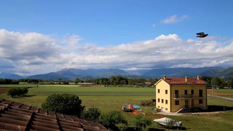 Timelapse Rooftop on Countryside Rolling Clouds and Home Stock Footage 129670316