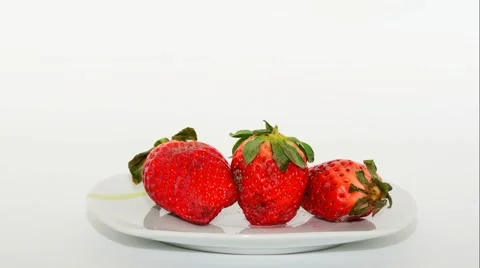 Timelapse rotting of three strawberries then ripe again Stock Footage 52010799