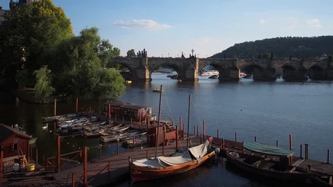 Timelapse of Row Boats moving in the currents next to Charles Bridge, Prague Stock Footage 93233603