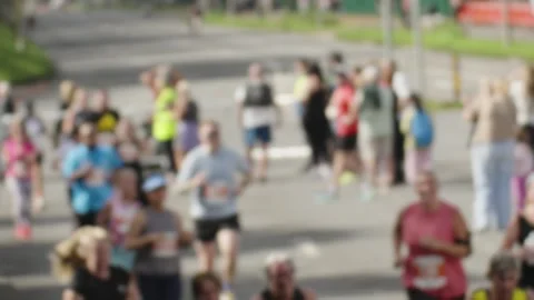 Timelapse of Runners in Marathon Race Speeding Past Camera Stock Footage 346582827