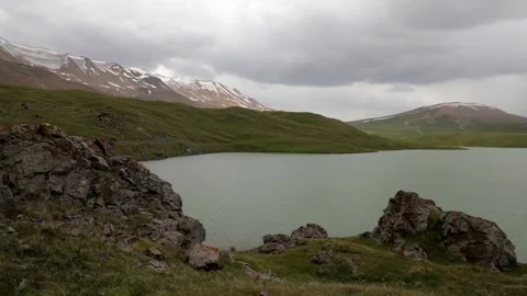 Timelapse of running clouds in the Lake in mountains Vídeos de archivo 169929929