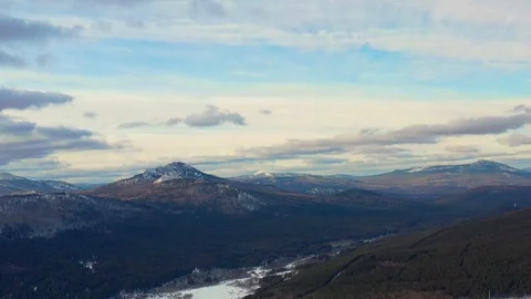 Timelapse of running clouds over a snowy mountain Stock Footage 125596873