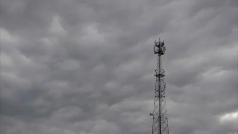 Timelapse. Running gray clouds on the background of the mobile communication tow 動画素材 140501467