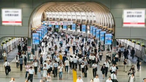 Timelapse of Rush Hour Commuters at Station in Tokyo -Tilt Down- Stock Footage